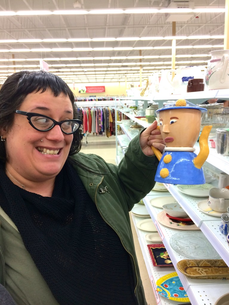 photo of a woman holding a teapot